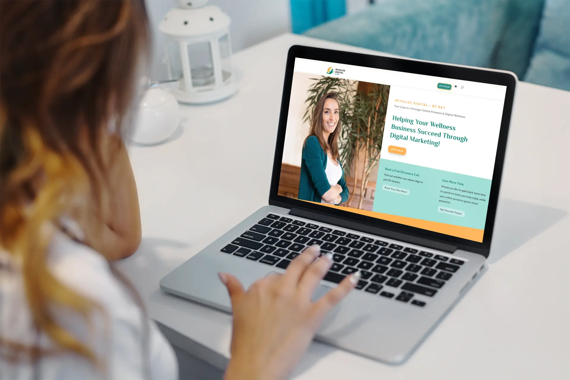 Woman looking at Reyalize Website Hosting displayed on her laptop on a desk